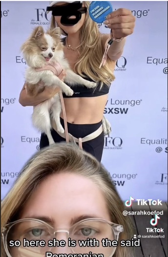 Karlee Hale holding a dog on a carpet