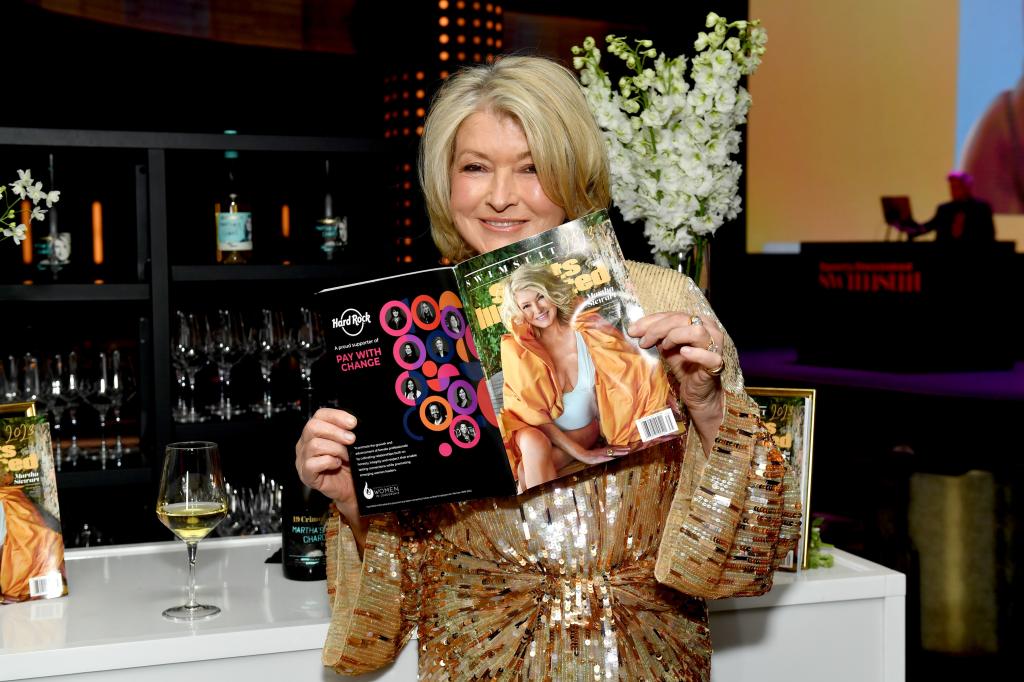 Martha Stewart holding her Sports Illustrated cover.