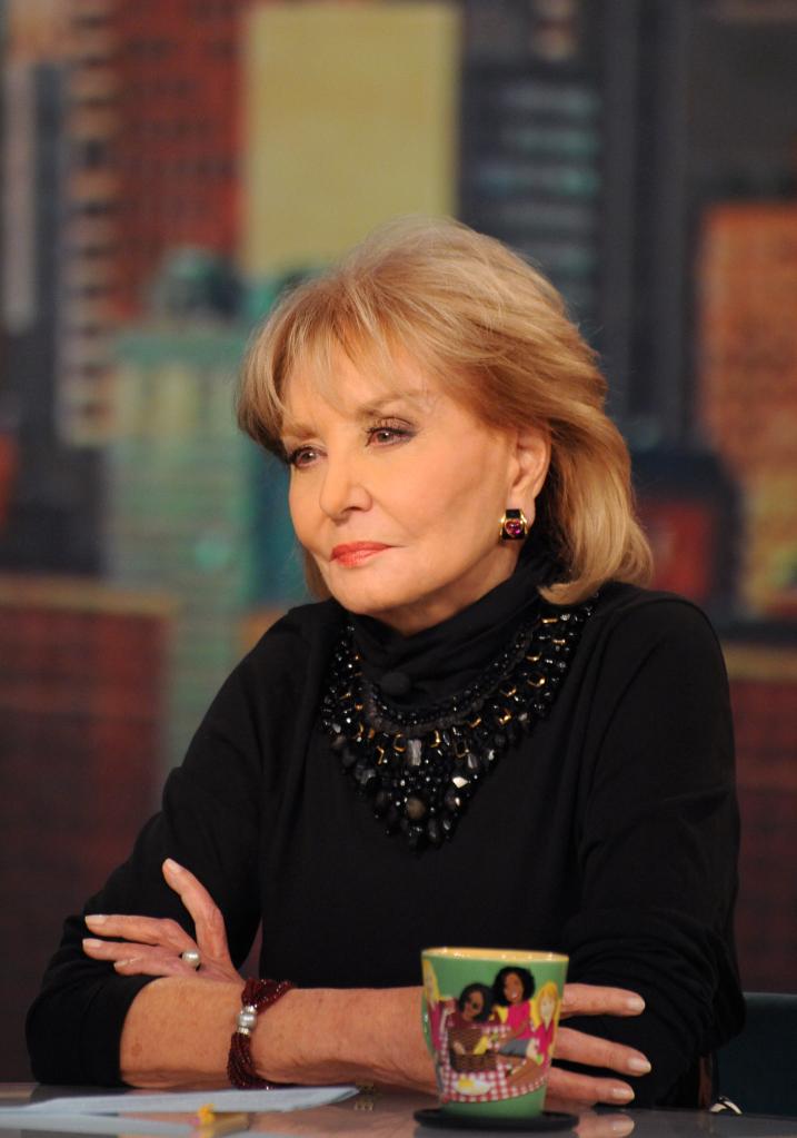 Barbara Walters sitting and staring