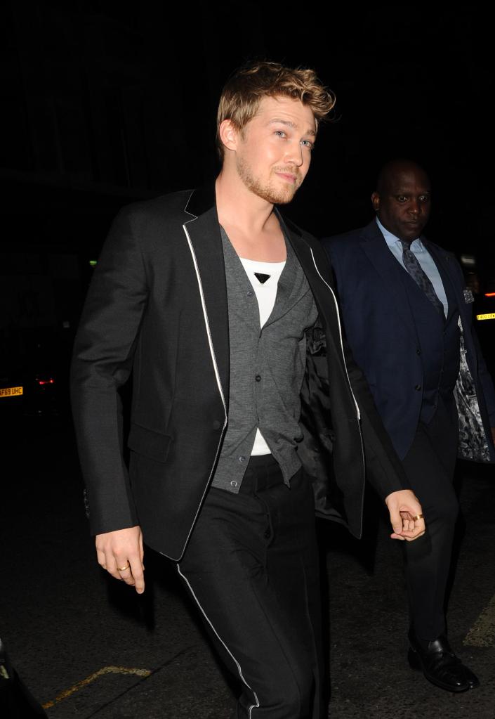 Joe Alwyn leaving a party.