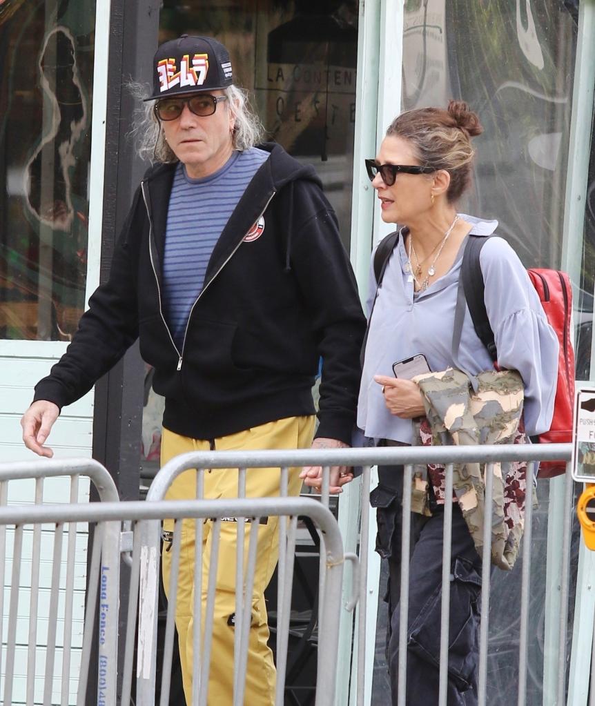 Daniel Day Lewis walks with Rebecca Miller