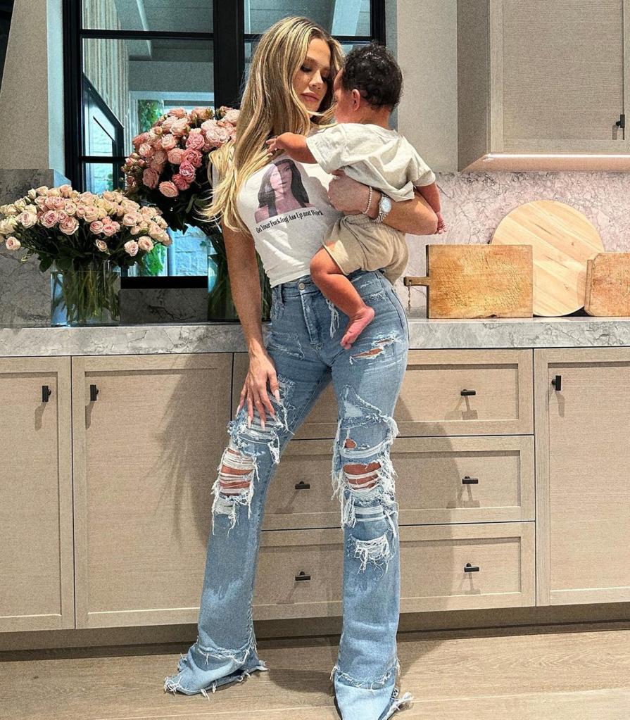 Khloe Kardashian carrying her son