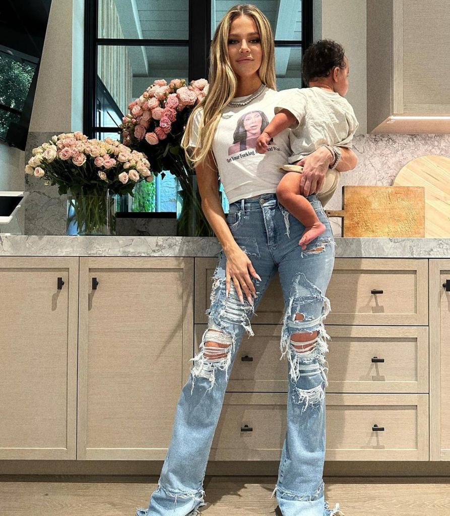 Khloe Kardashian carrying her son