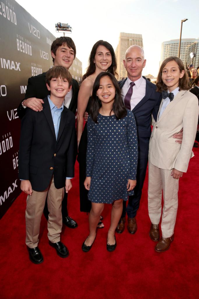 Jeff Bezos and MacKenzie Scott posing with their kids on a red carpet.