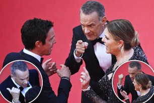 Tom Hanks and wife Rita Wilson scolding a man on the red carpet with two insets of them talking to that man.