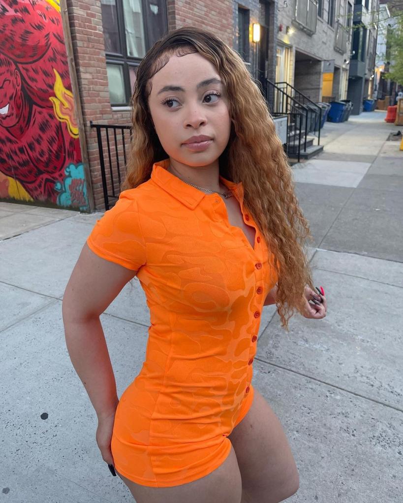 Ice Spice wears orange