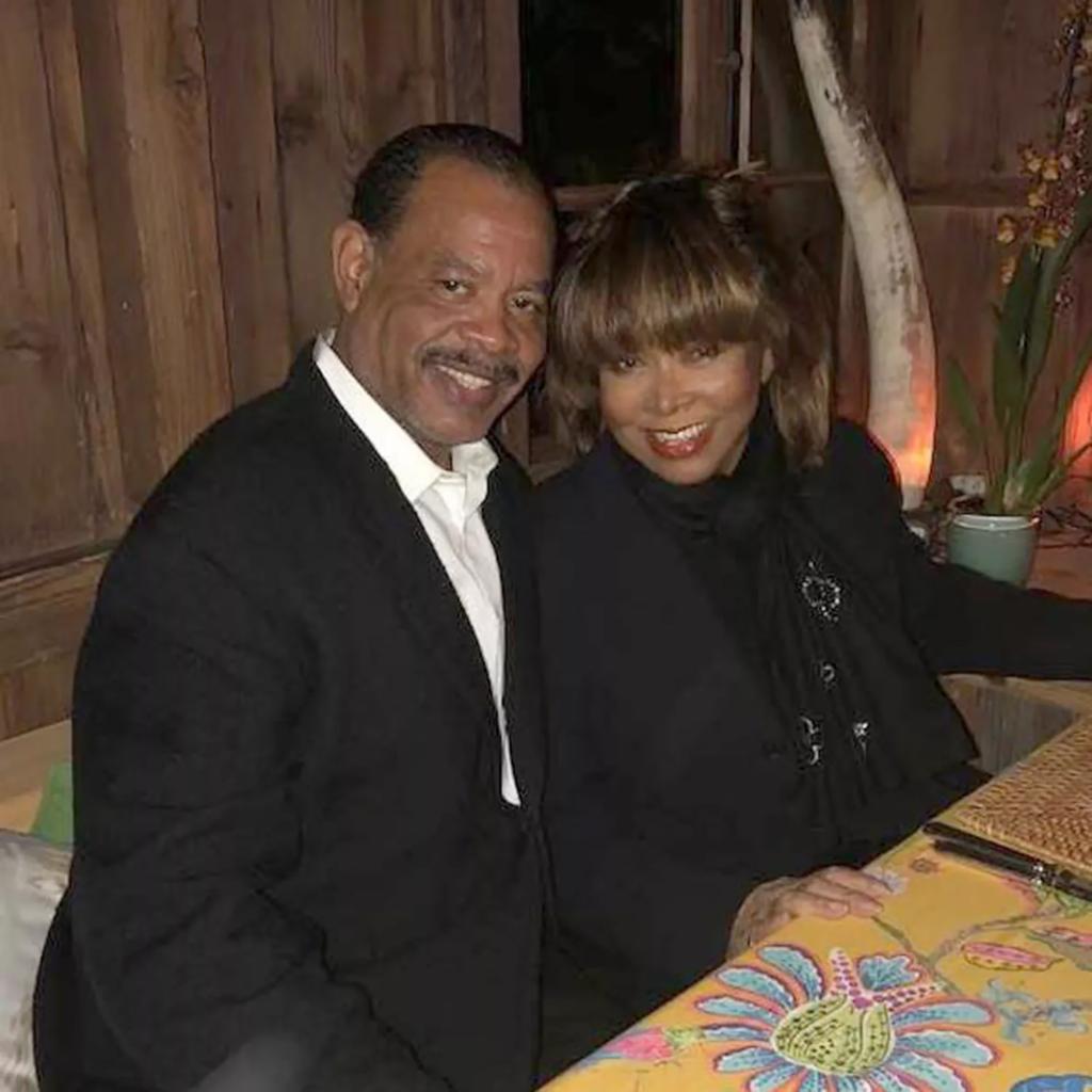 Tina Turner and Raymond Craig smiling together. 