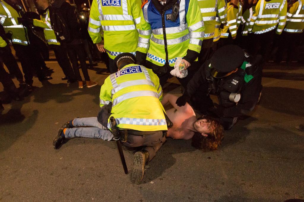 Jack Bissell being arrested during a protest.