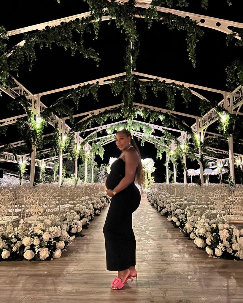 Pregnant Serena Williams posing in a long black dress in Italy.