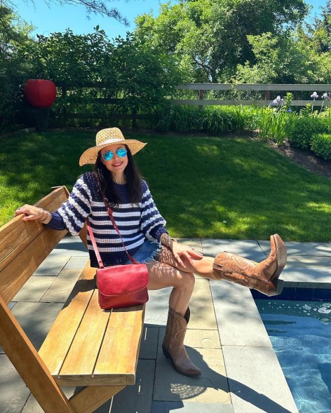 Bethenny Frankel sitting by a pool