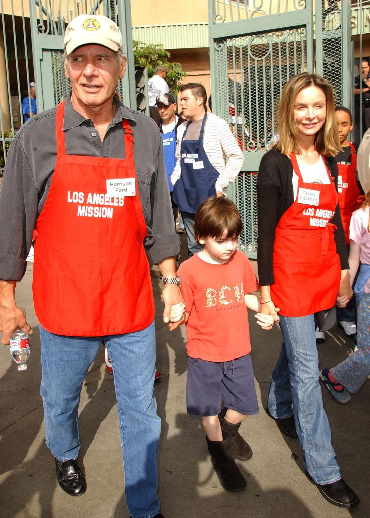 Harrison Ford and Calista Flockhart hold son Liam's hands