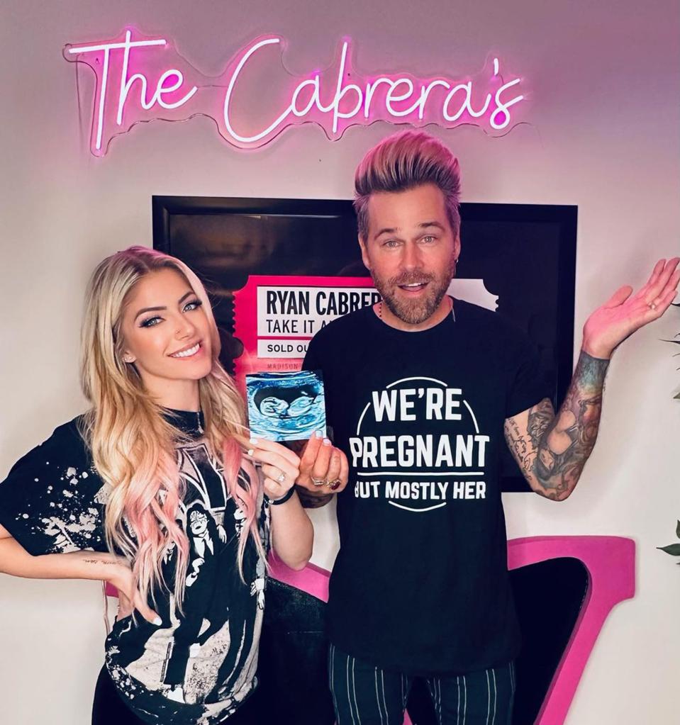 Ryan Cabrera and Alexa Bliss hold ultrasound