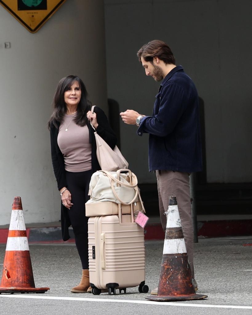 Lynne Spears and an unidentified man standing together.