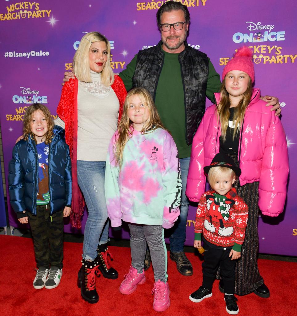 Tori Spelling and Dean McDermott on a red carpet with their kids.