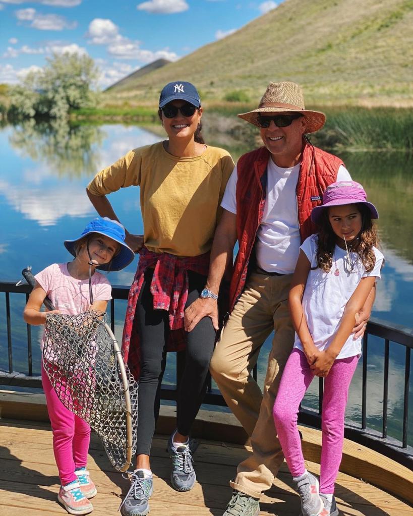 Bruce Willis and Emma Heming pose outdoors with Mabel and Evelyn