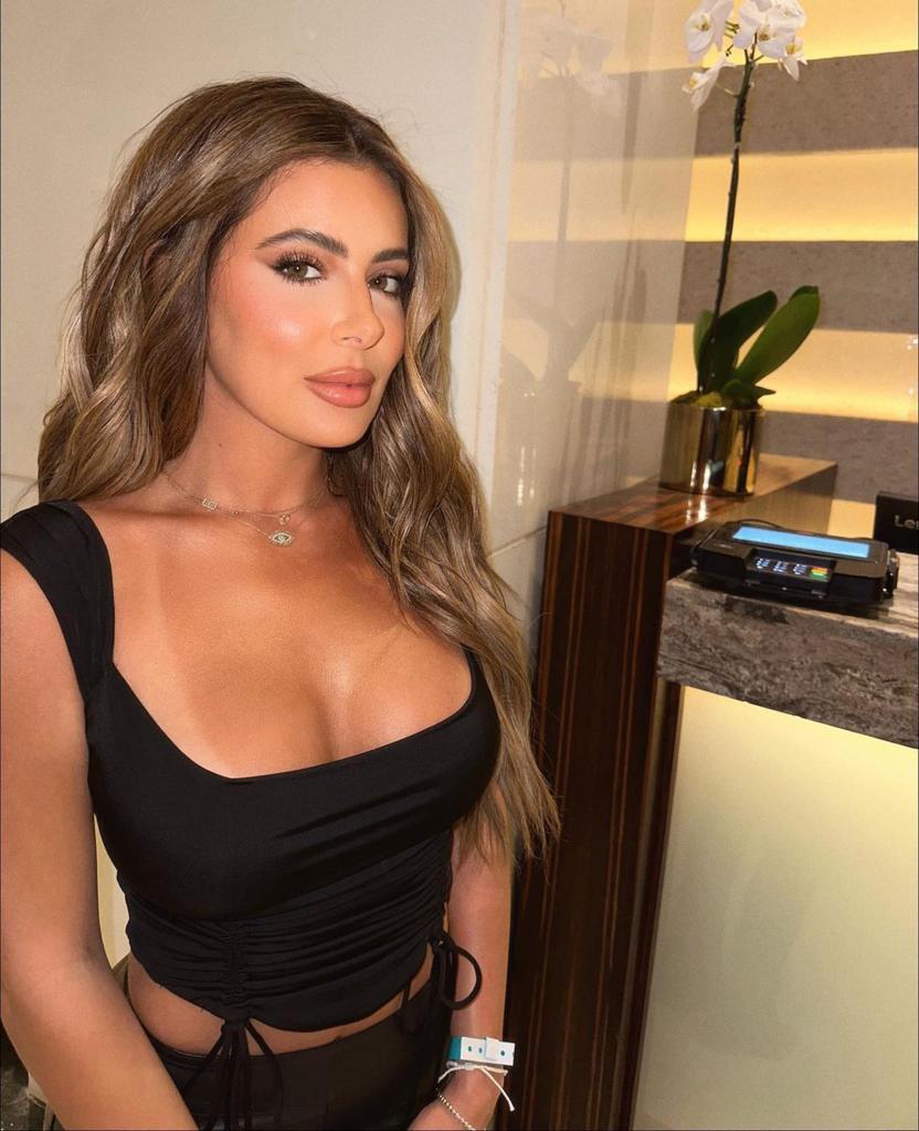 Brielle Biermann poses in black top