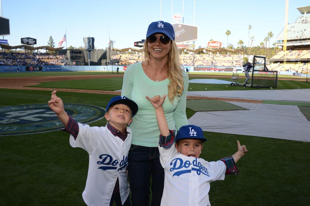Britney Spears and her sons at a baseball game.