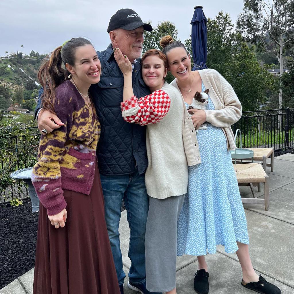 Bruce Willis is hugged by Scout, Tallulah and Rumer