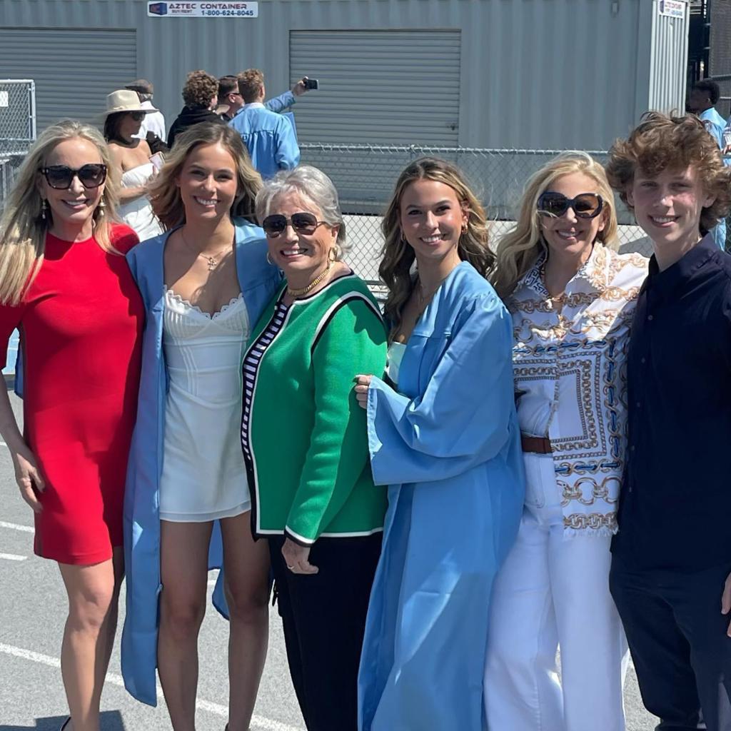 Shannon Beador and twin daughters pose for family photo at graduation