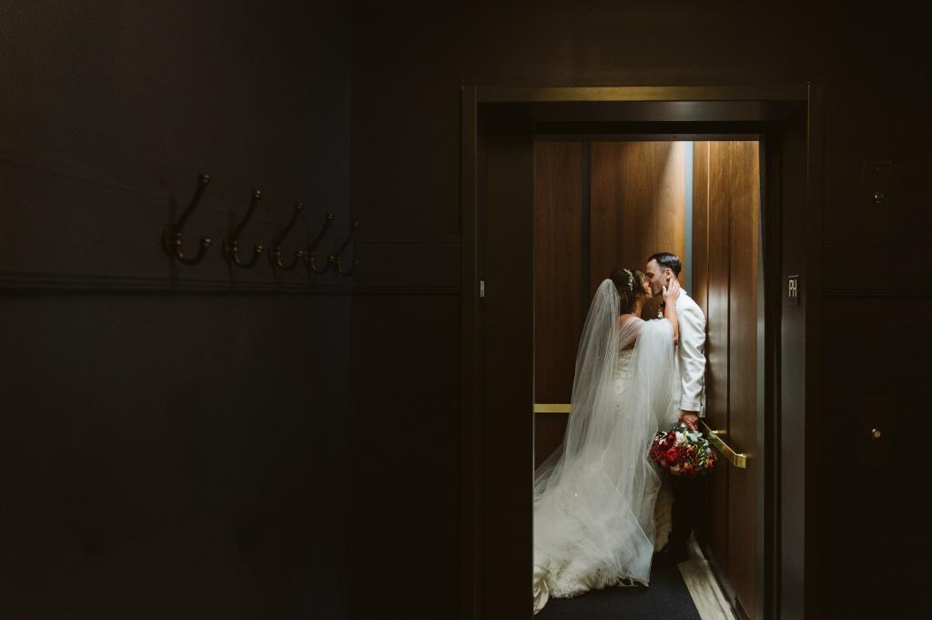 Alaina Scott and Matt Moeller kissing at their wedding.