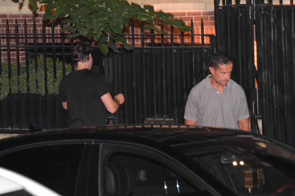 Bodyguards outside of Madonna's home.