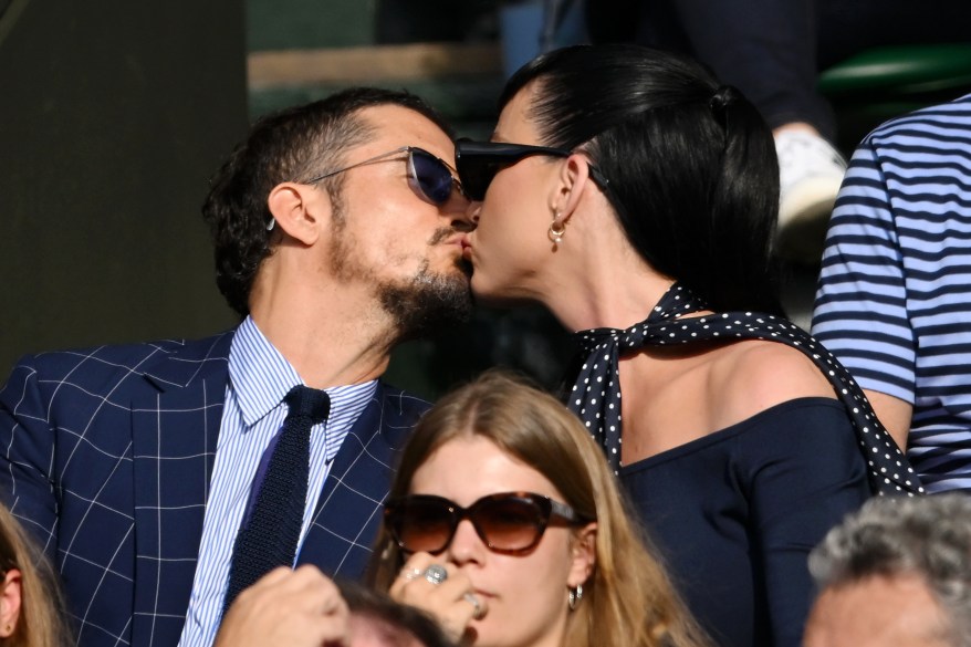 Orlando Bloom and Katy Perry kiss at Wimbledon on July 5, 2023.