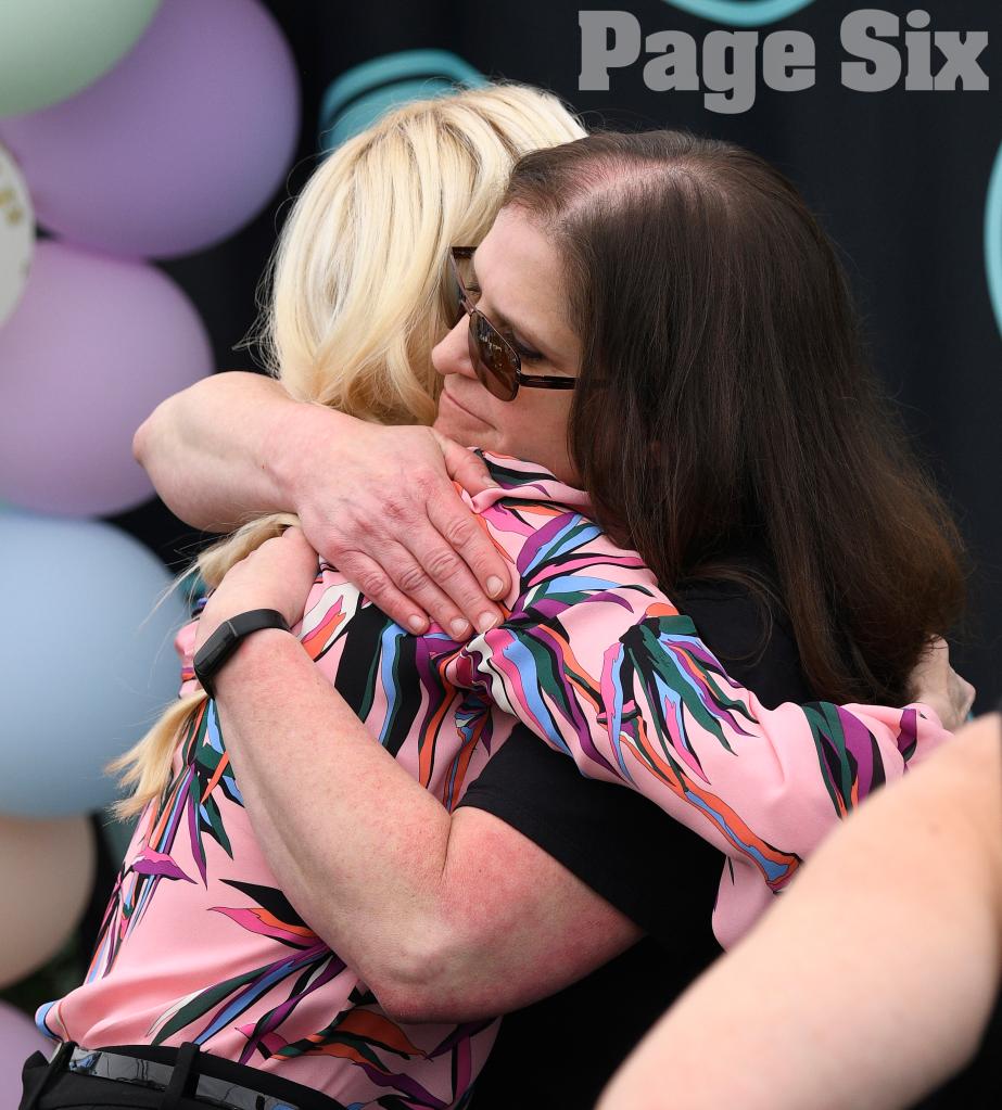 Erika Jayne hugging woman