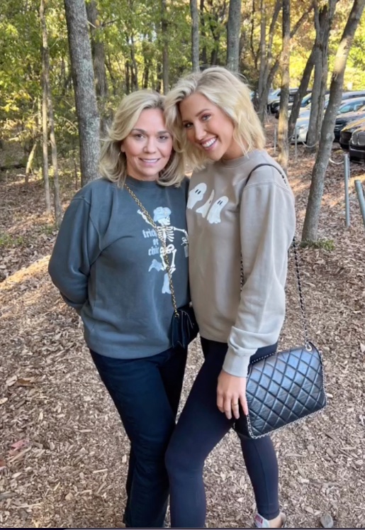 Savannah and Julie Chrisley posing for a photo together 