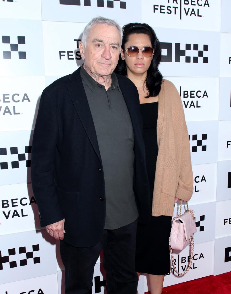 Robert De Niro and Tiffany Chen on a red carpet.