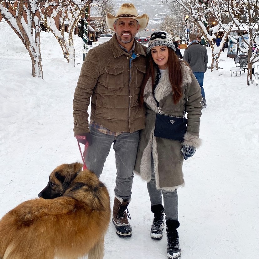 kyle richards and mauricio umansky in the snow with their dog