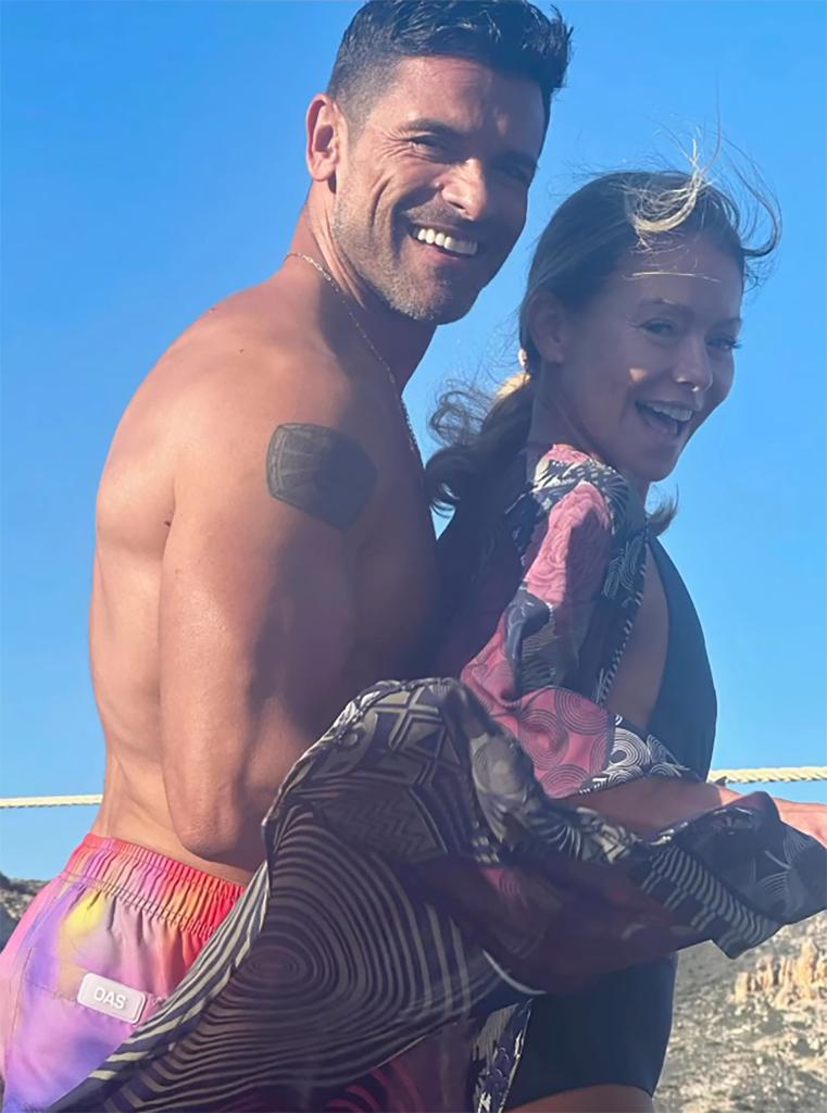 Mark Consuelos and Kelly Ripa on the beach