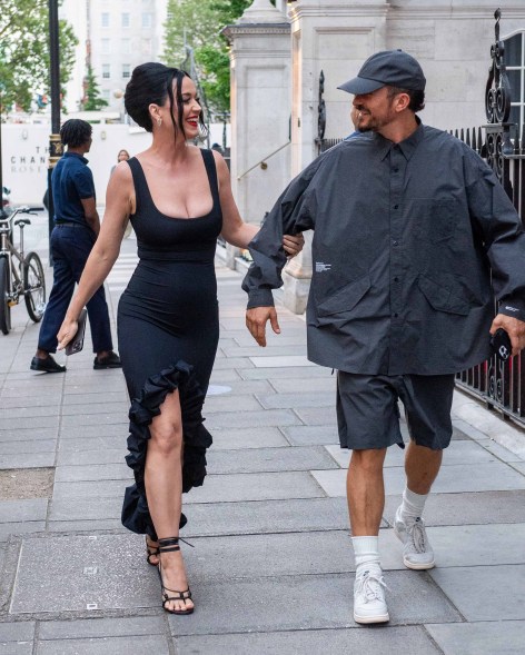 Katy Perry and Orlando Bloom smiling at each other