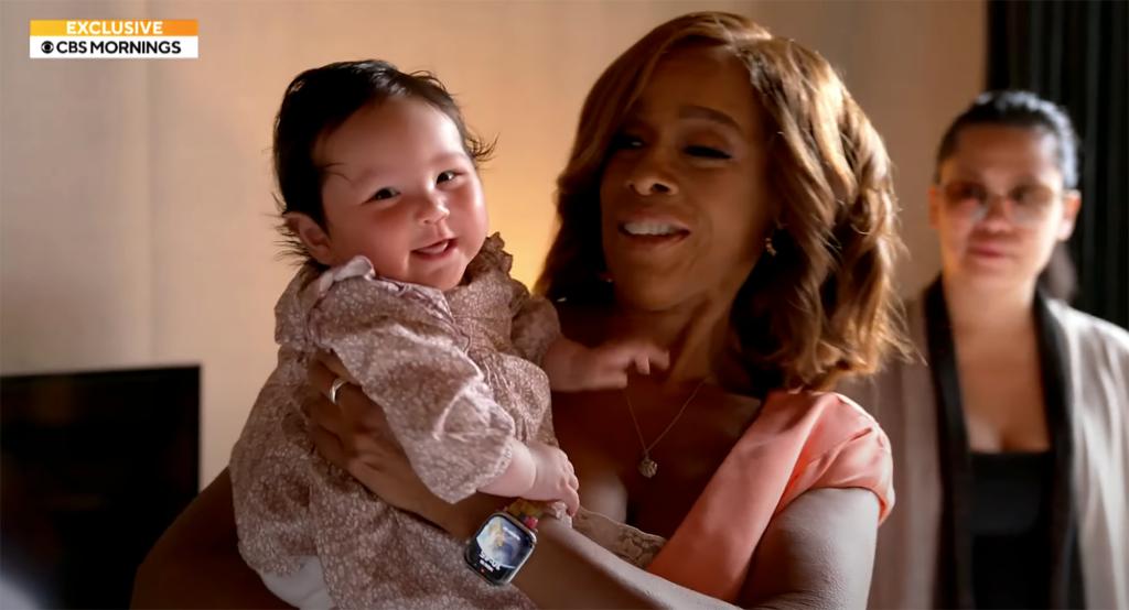 Tiffany Chen and Gayle King holding Gia.