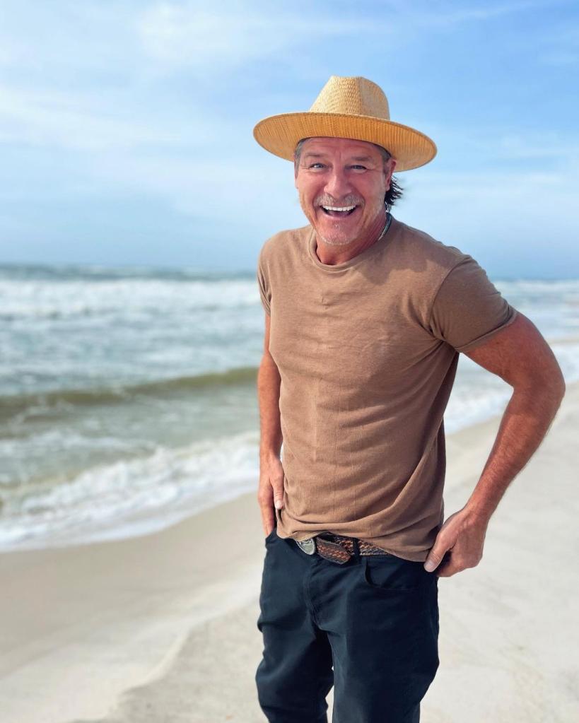 Ty Pennington on a beach.