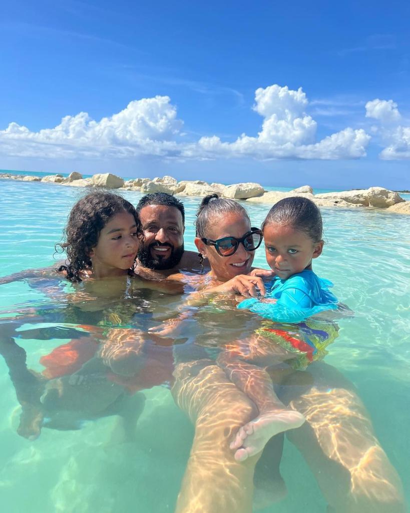 DJ Khaled and wife Nicole with sons at the beach.