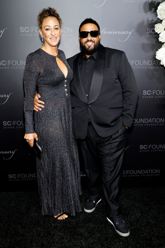 DJ Khaled and his wife Nicole posing at the Shawn Carter Black Tie Gala.