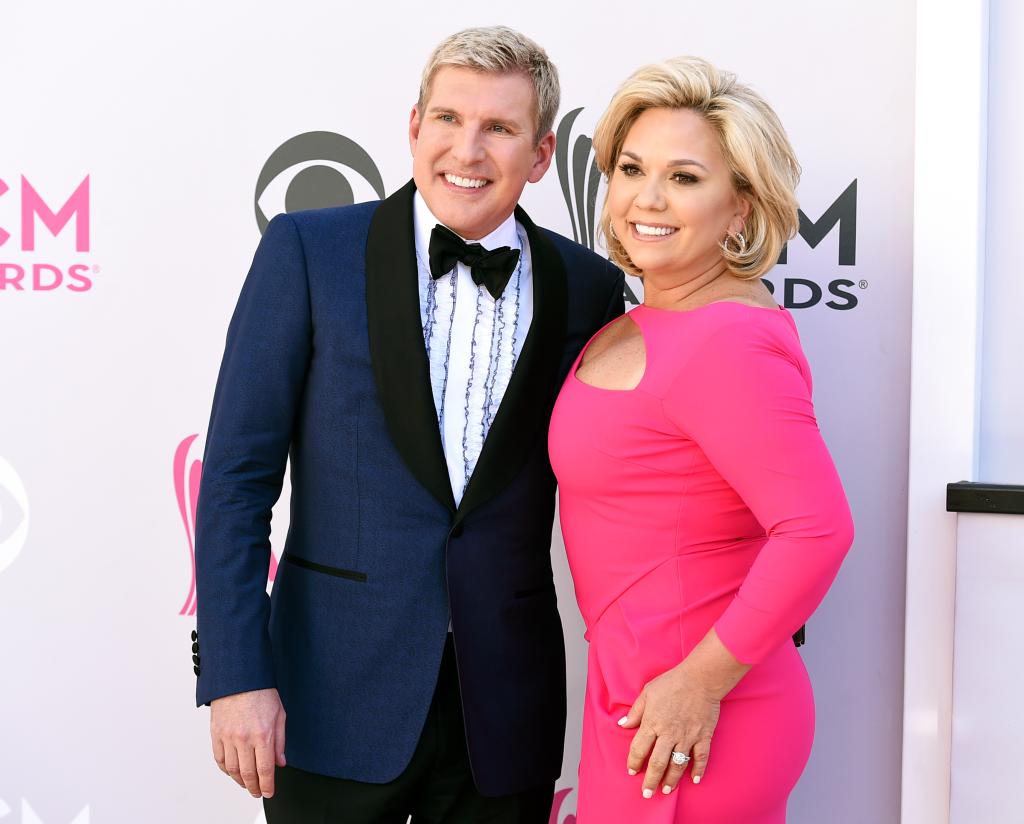 Todd and Julie Chrisley posing on a red carpet