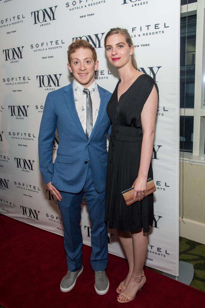 Ethan Slater and Lilly Jay posing together on a red carpet.