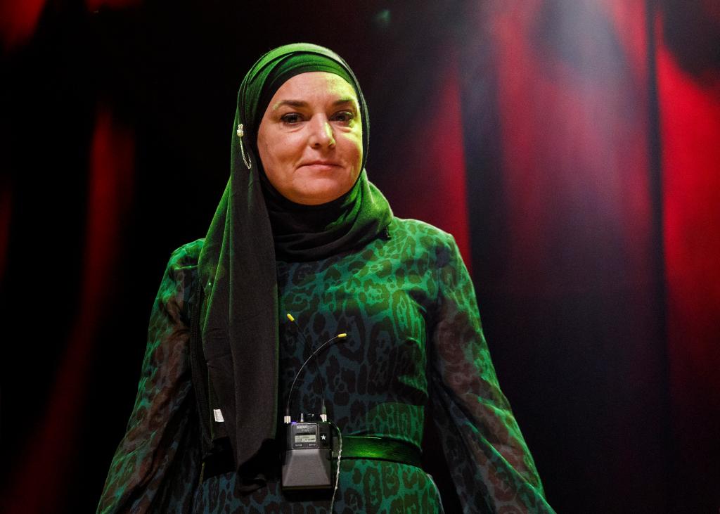 Sinéad O'Connor wearing a headscarf.