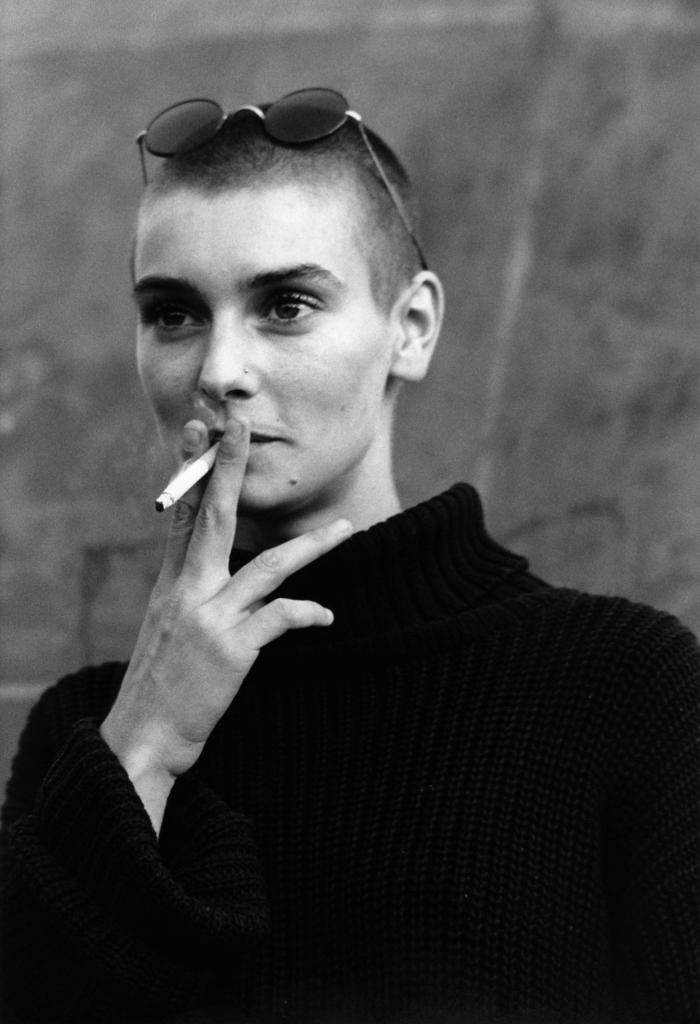 Sinéad O'Connor smoking a cigarette.