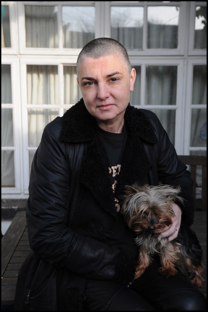 sinead o'connor holding onto her dog