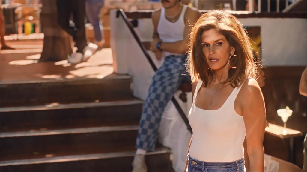 Cindy Crawford walking in the "One Margarita (Saucy Remix)" music video.