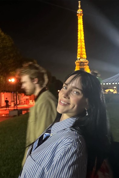 CAN'T STIFLE THE EIFFEL: With bro Finneas in tow, Billie Eilish hits the Parisian sights when in town for a Global Citizen performance.