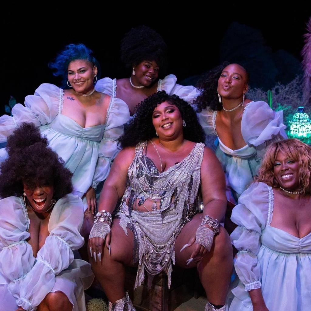Lizzo on stage with backup dancers. 