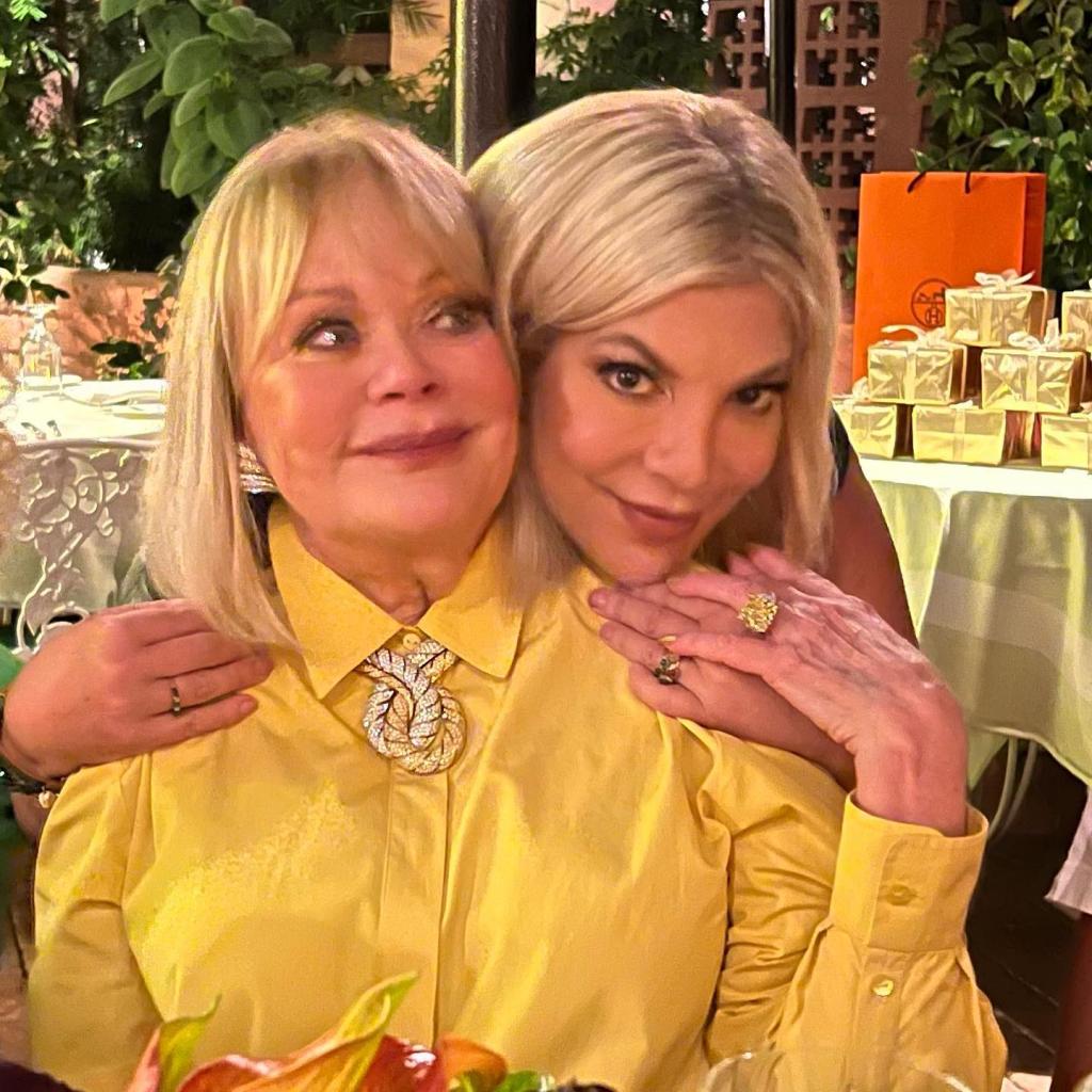 Tori Spelling hugging her mom, Candy.