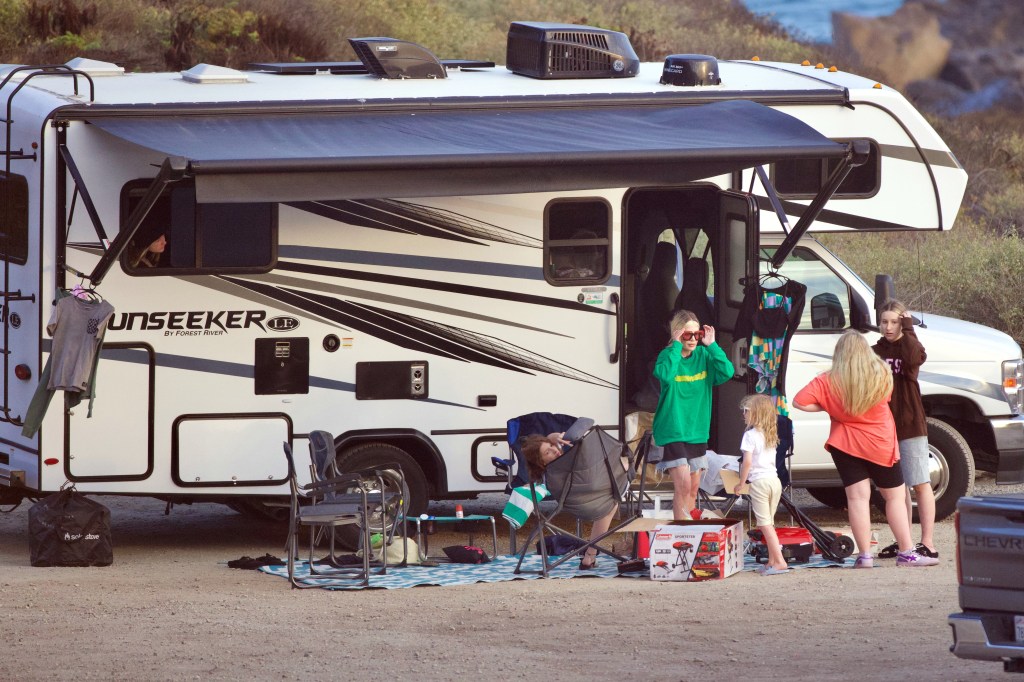tori spelling and kids camping outside of an RV