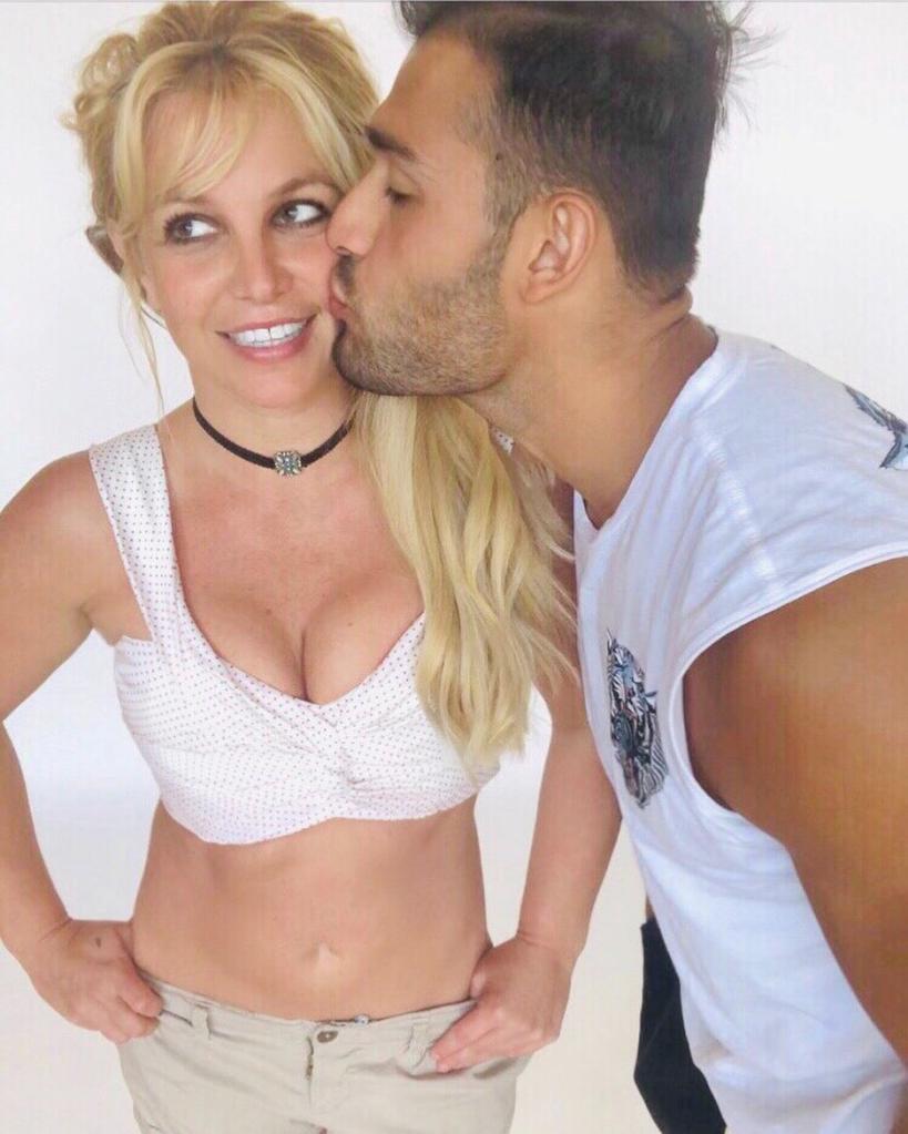 Sam Asghari kissing Britney Spears.