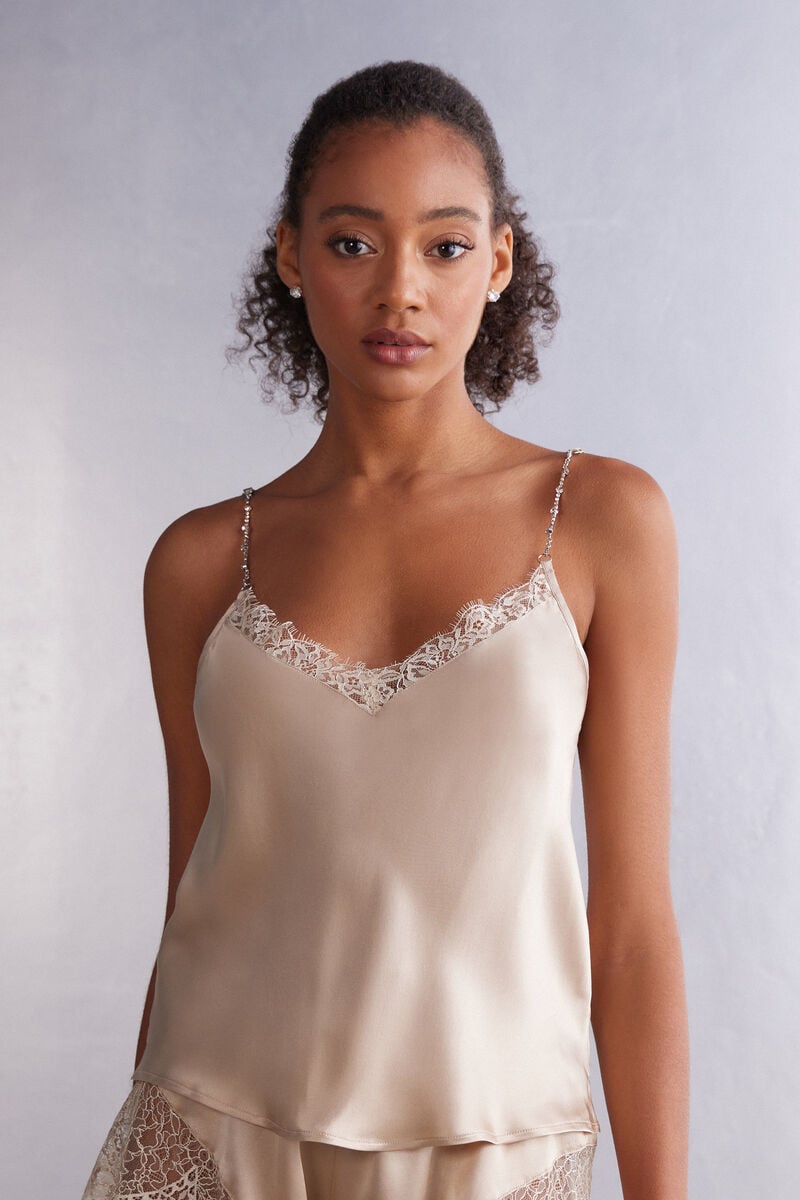 A model in a biege camisole