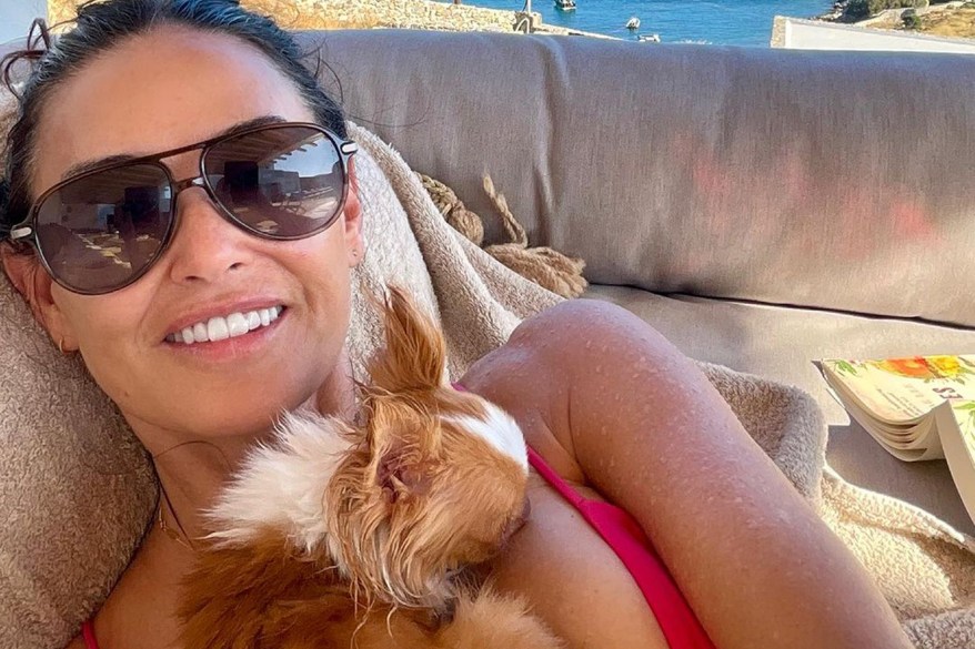 Swimsuit-clad Demi lounges with her pup in 'paradise'