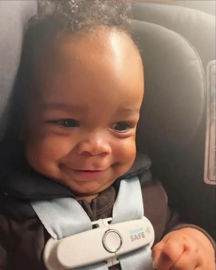 Rza smiling in his carseat.